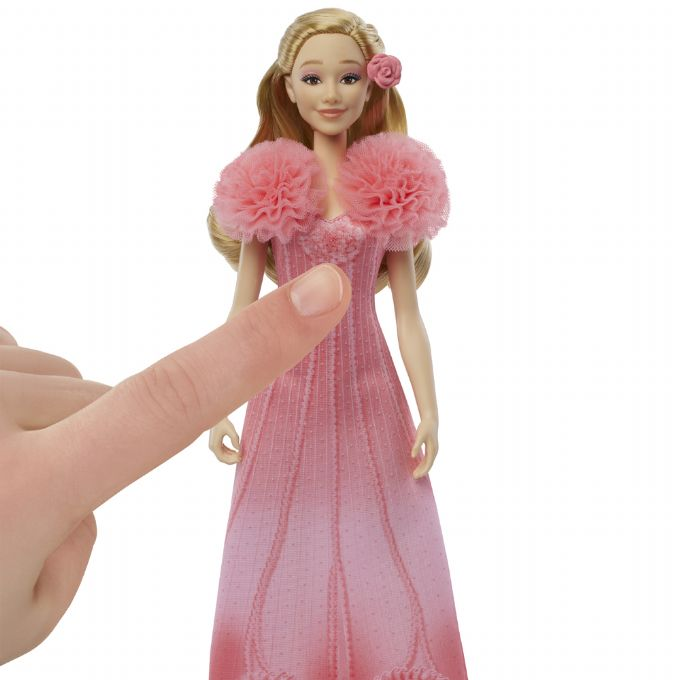 Syngende Glinda-dukke version 5