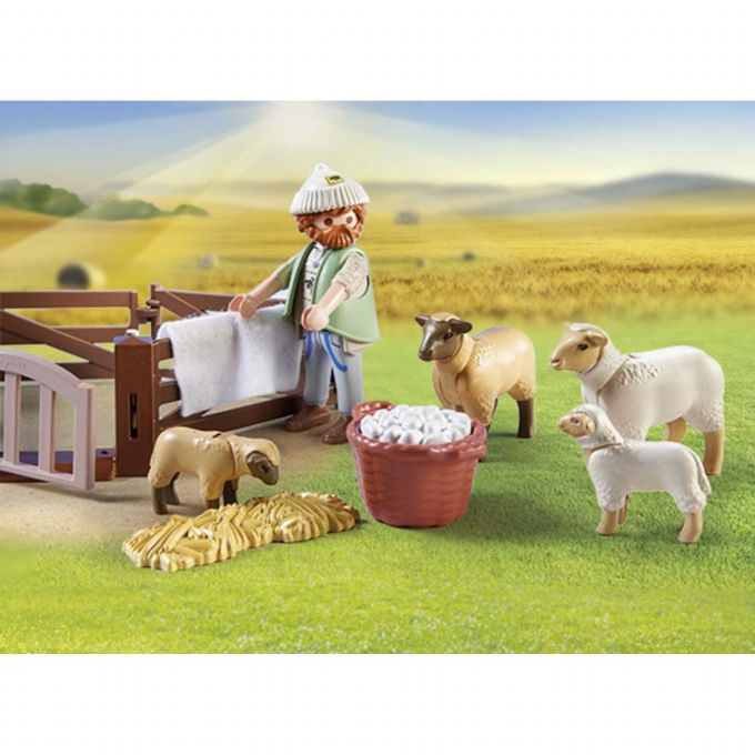 Young shepherd with flock of sheep version 4