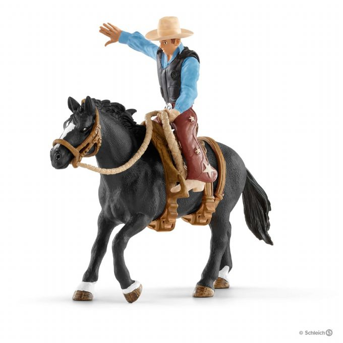 Saddle bronc riding med cowboy